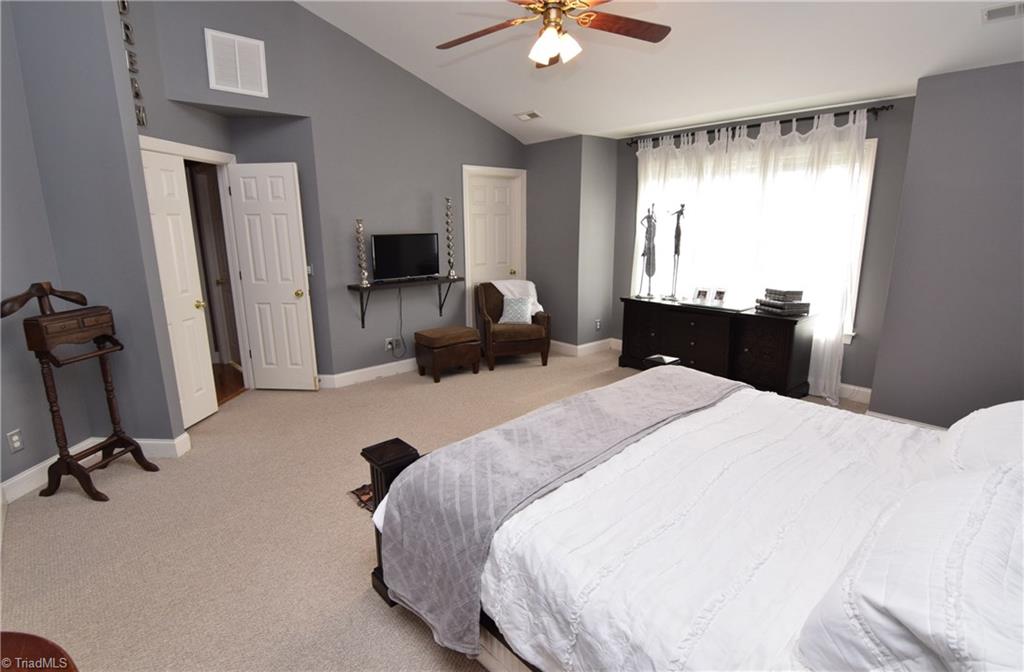 704 Number Ten Way Oak Ridge, NC 27310 - Photo 14 of 30 Master suite features vaulted ceilings, two walk-in closets AND an additional closet.