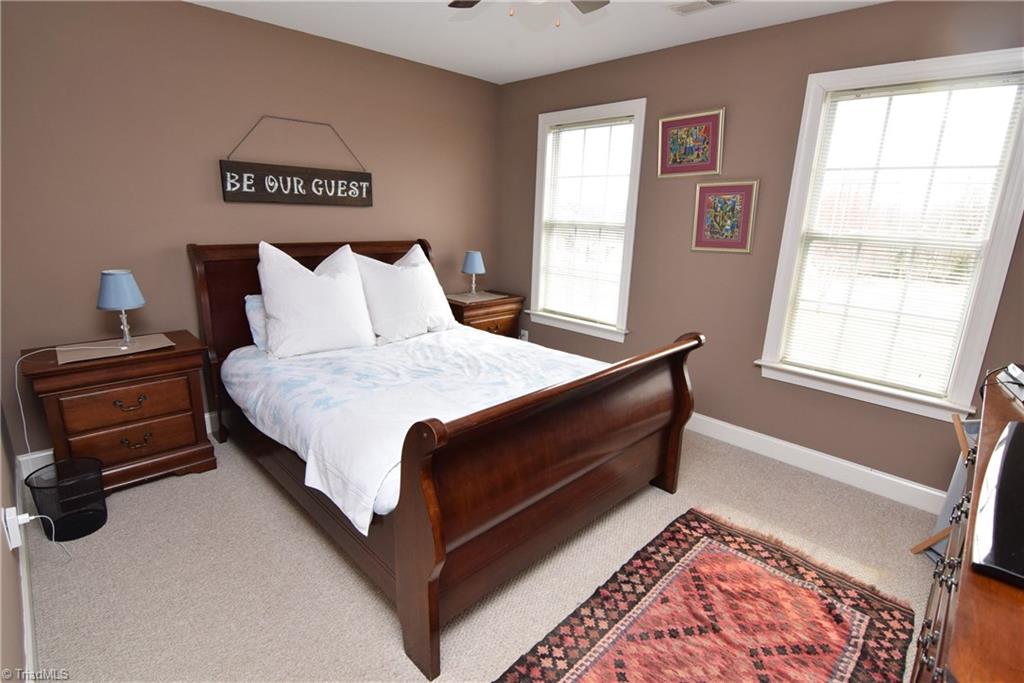 704 Number Ten Way Oak Ridge, NC 27310 - Photo 19 of 30 The second bedroom has a walk in closet.