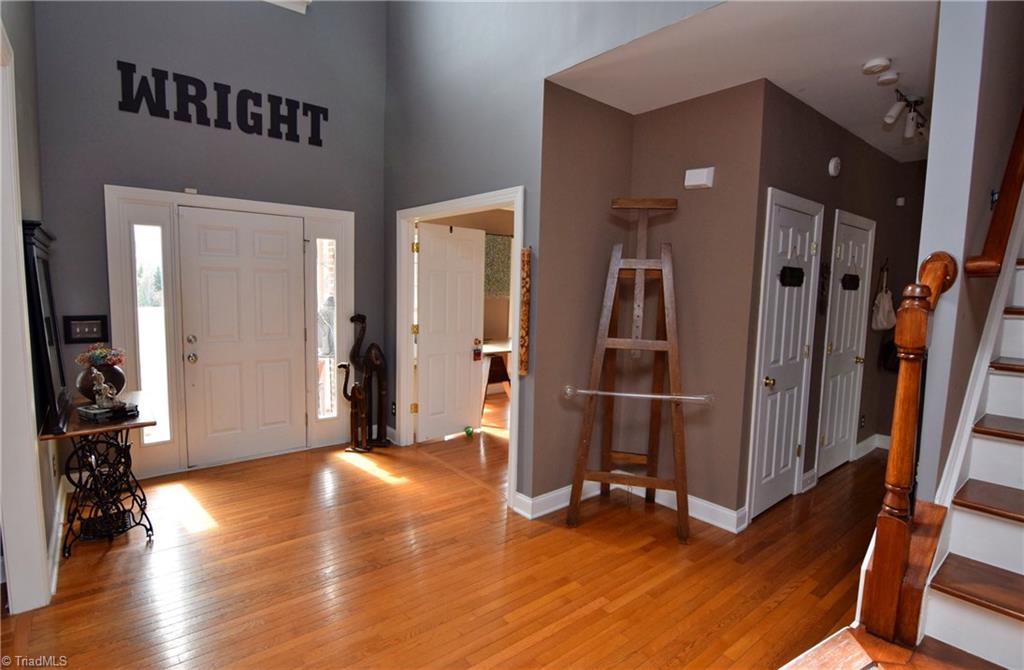 704 Number Ten Way Oak Ridge, NC 27310 - Photo 3 of 30 Elegant two story foyer and gleaming hardwood floors