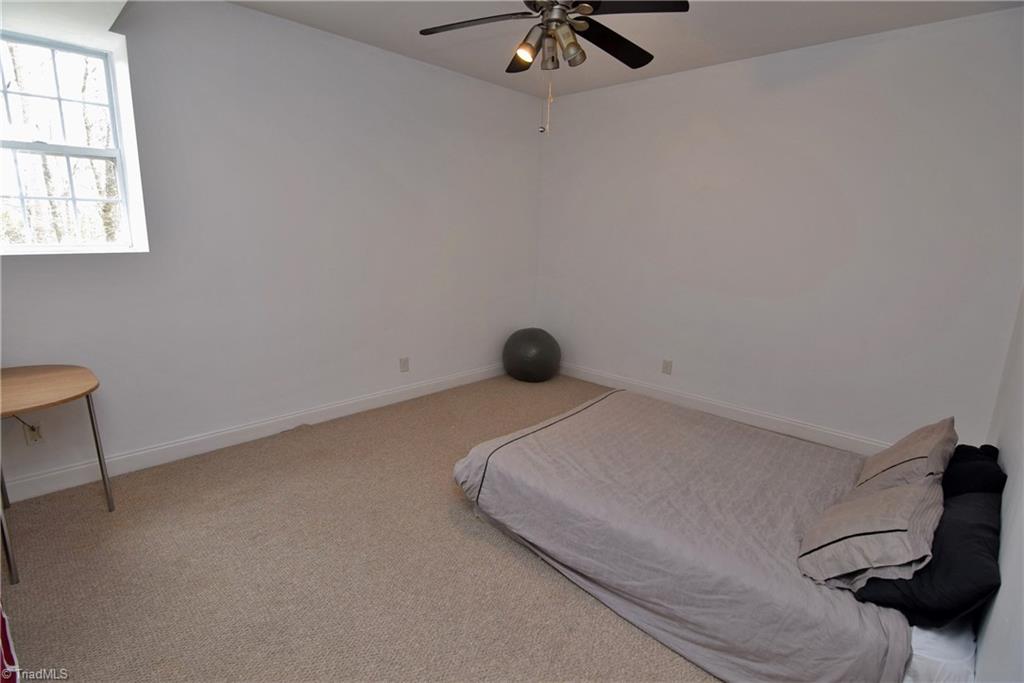 704 Number Ten Way Oak Ridge, NC 27310 - Photo 27 of 30 Yet another lower level room! So much space!