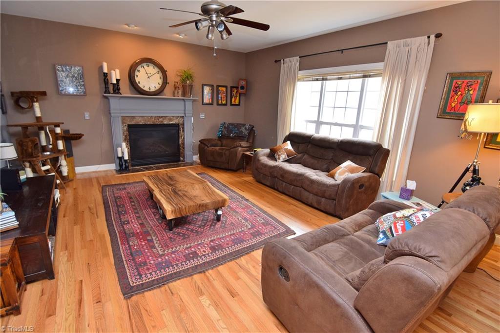 704 Number Ten Way Oak Ridge, NC 27310 - Photo 6 of 30 Den with gas log fireplace - what a beautiful mantel!