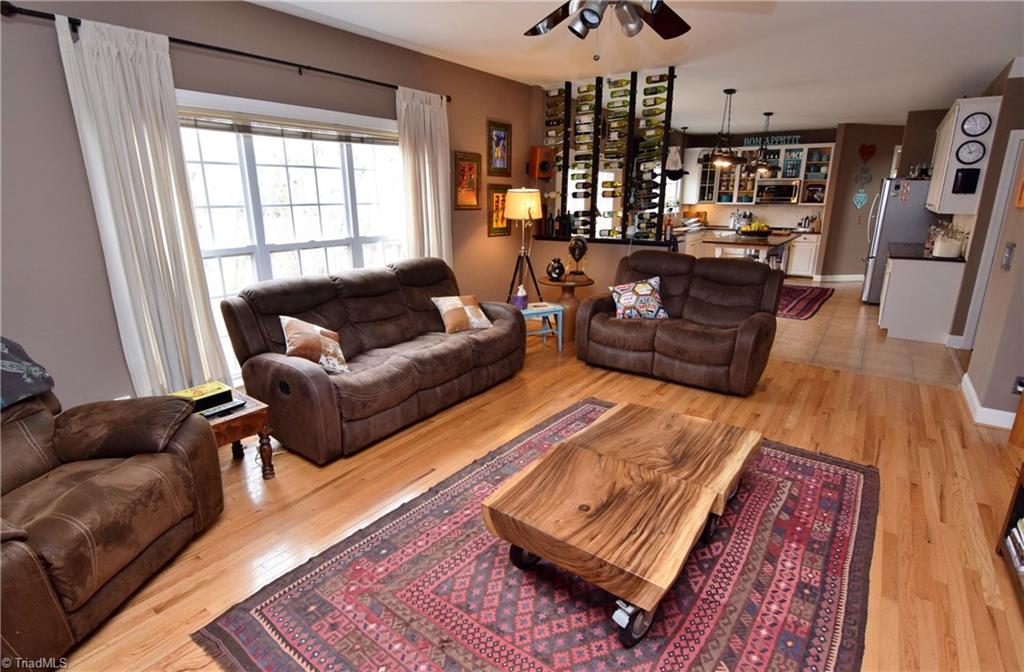 704 Number Ten Way Oak Ridge, NC 27310 - Photo 7 of 30 A perfect place to entertain! Den opens to a fantastic kitchen.
