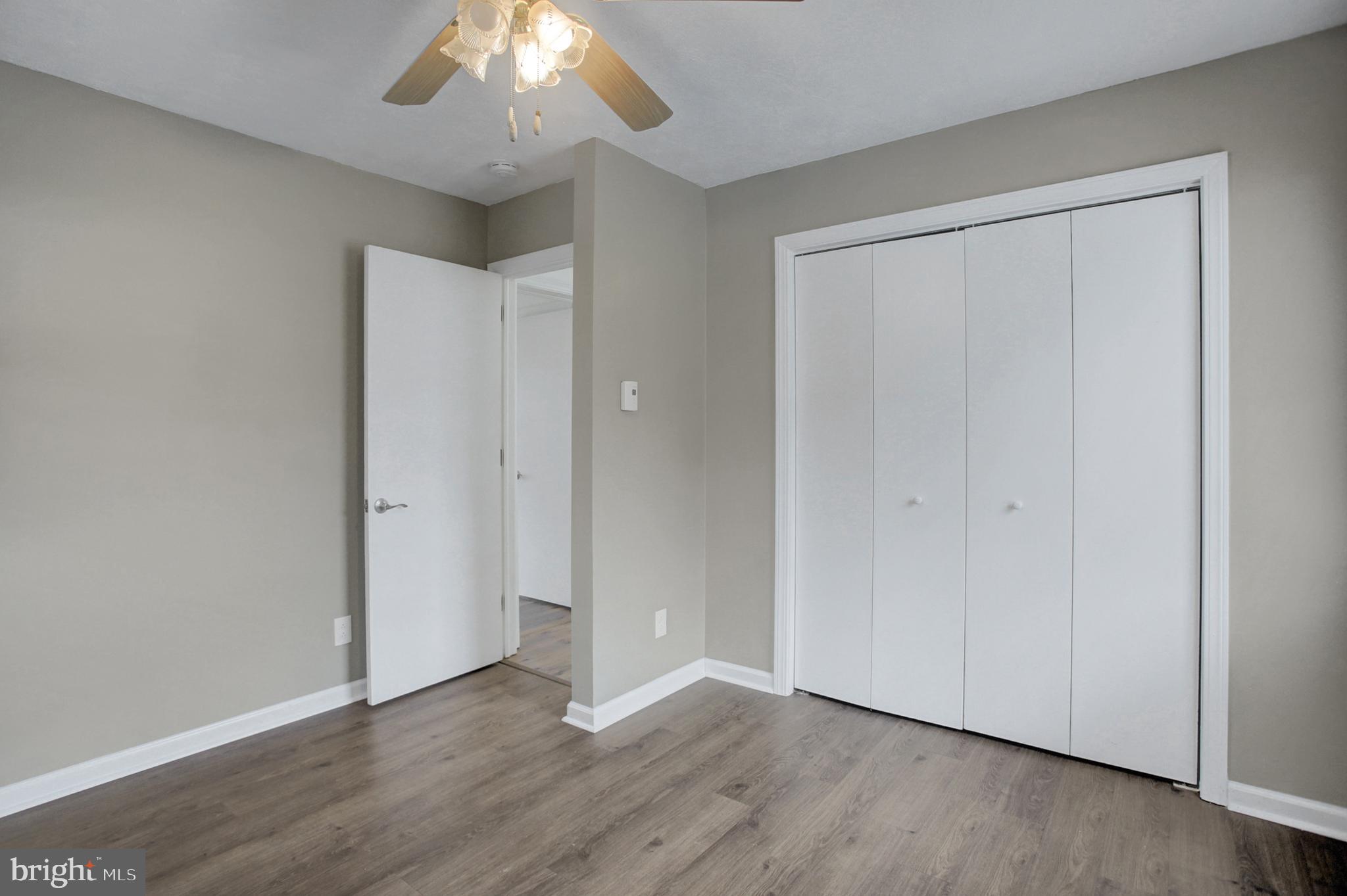16944 Shinham Road Hagerstown, MD 21740 - Photo 17 of 29 a view of an empty room with wooden floor and a window