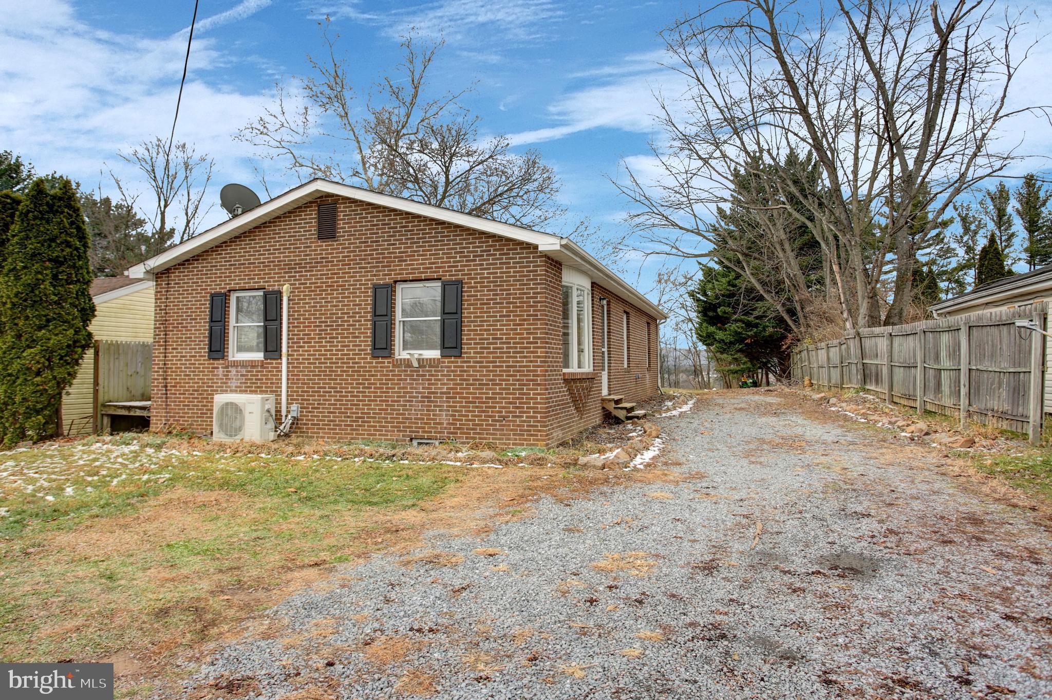 16944 Shinham Road Hagerstown, MD 21740 - Photo 23 of 29 a view of a house with a yard
