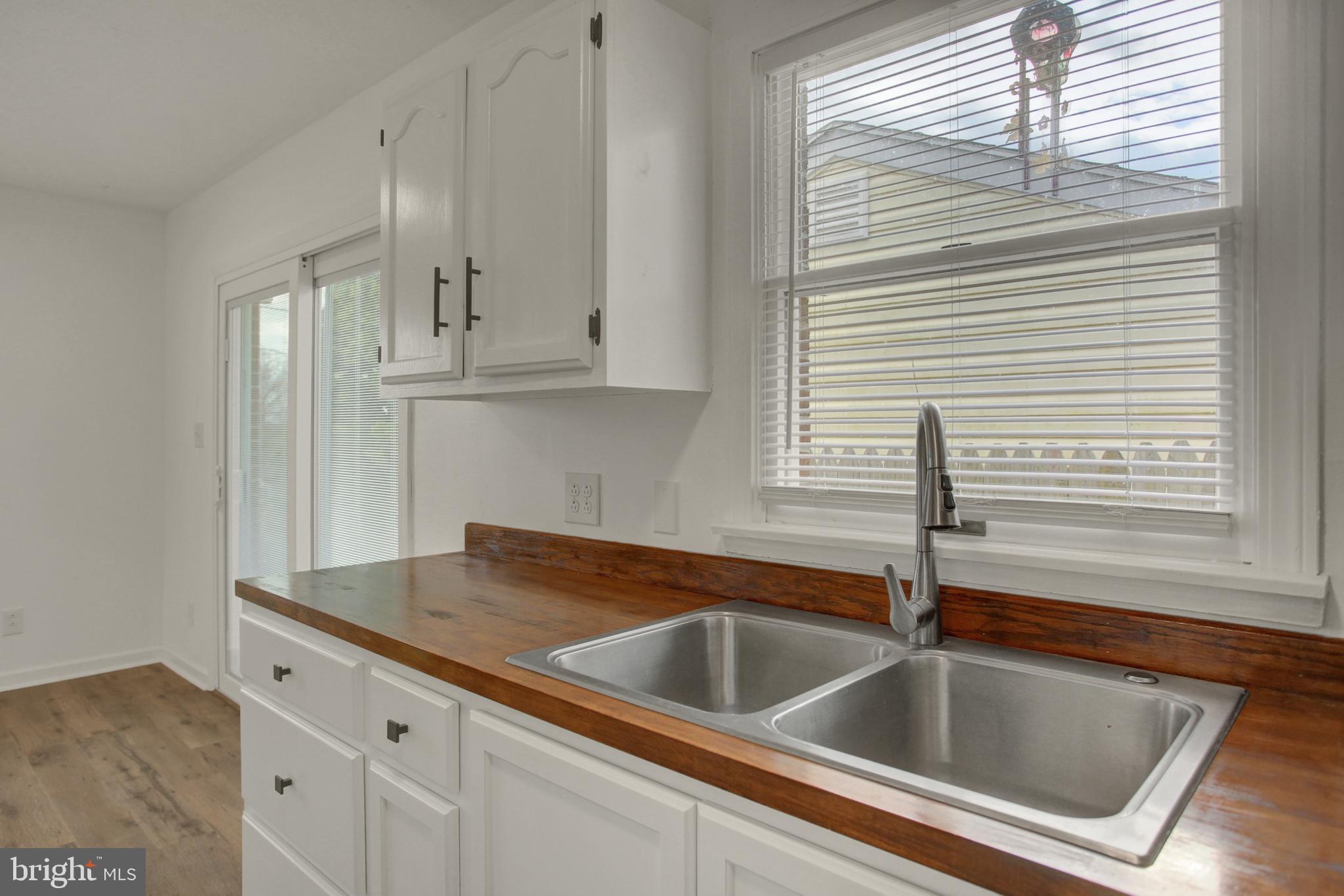 16944 Shinham Road Hagerstown, MD 21740 - Photo 7 of 29 a view white cabinets and a sink