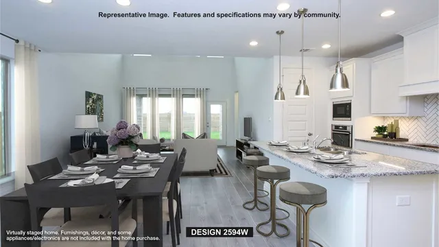 a open dining room with furniture a rug and kitchen view