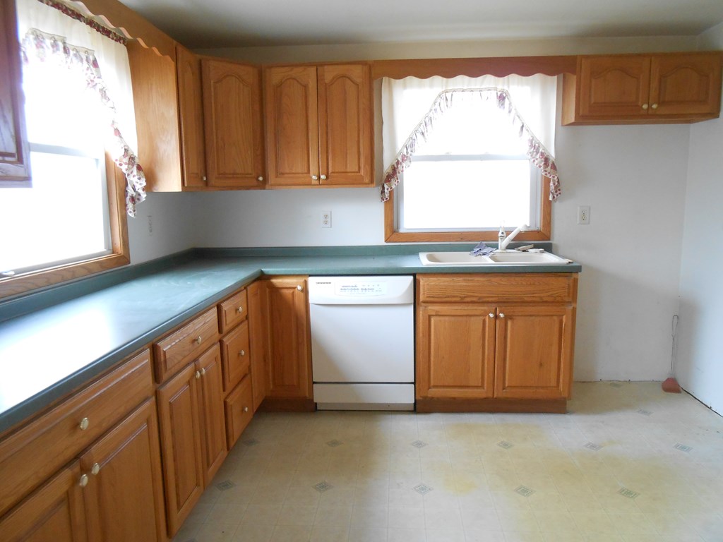 1312 Mercer Road Franklin, PA 16323 - Photo 6 of 15 a view of a kitchen with a sink cabinets and a window