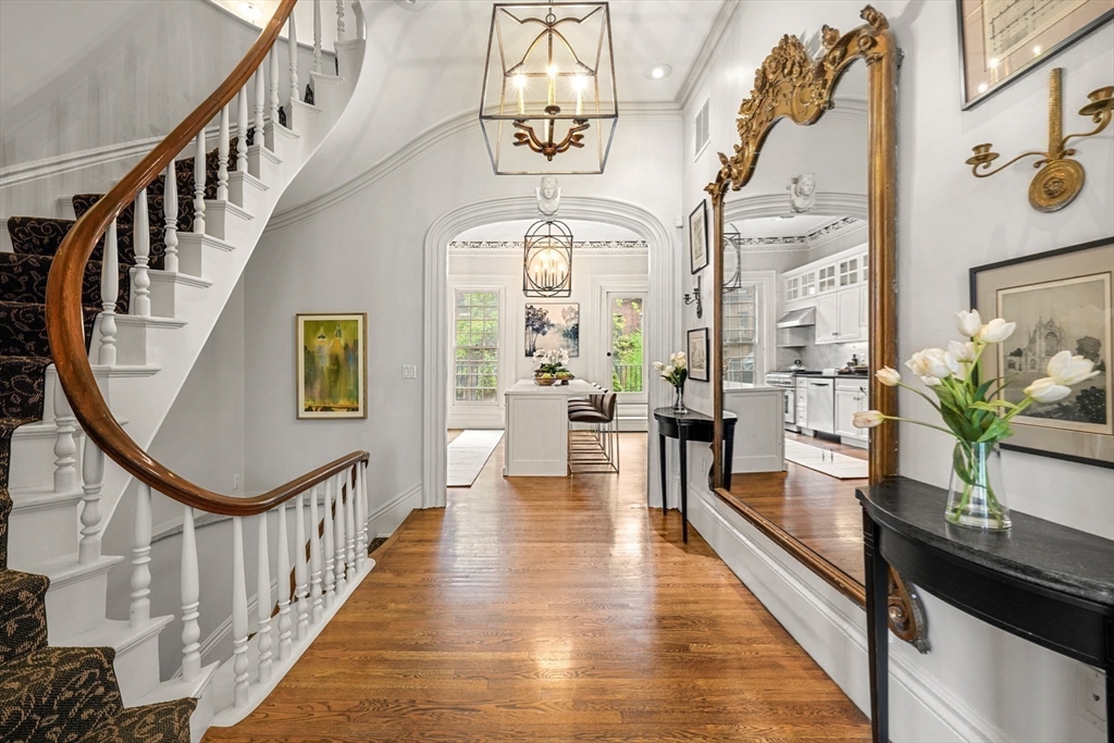 22 Rutland Square, Unit 2 Boston, MA 02118 - Photo 17 of 42 a view of a hallway with wooden floor and staircase