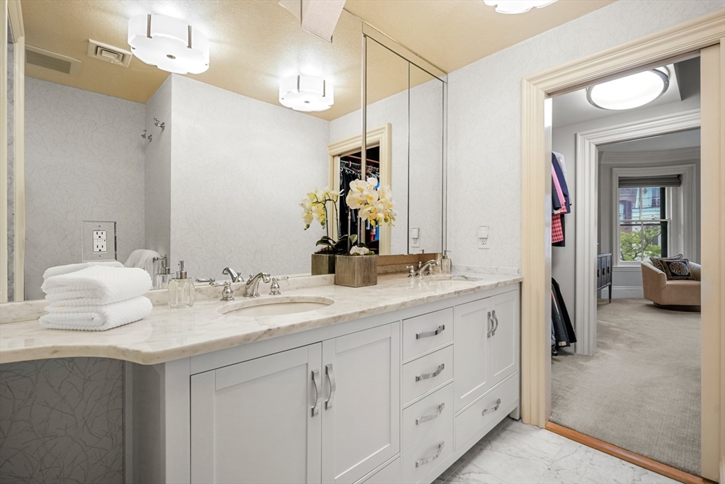 22 Rutland Square, Unit 2 Boston, MA 02118 - Photo 22 of 42 a en suite bathroom with a granite countertop sink and a mirror
