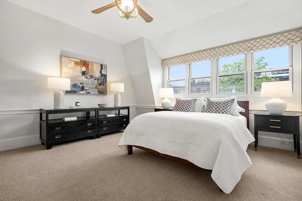 22 Rutland Square, Unit 2 Boston, MA 02118 - Photo 29 of 42 a spacious bedroom with a bed and window