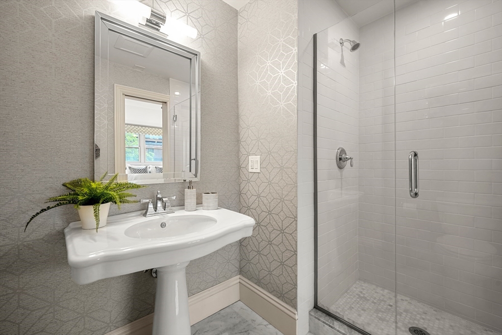 22 Rutland Square, Unit 2 Boston, MA 02118 - Photo 31 of 42 a bathroom with a sink a mirror and shower