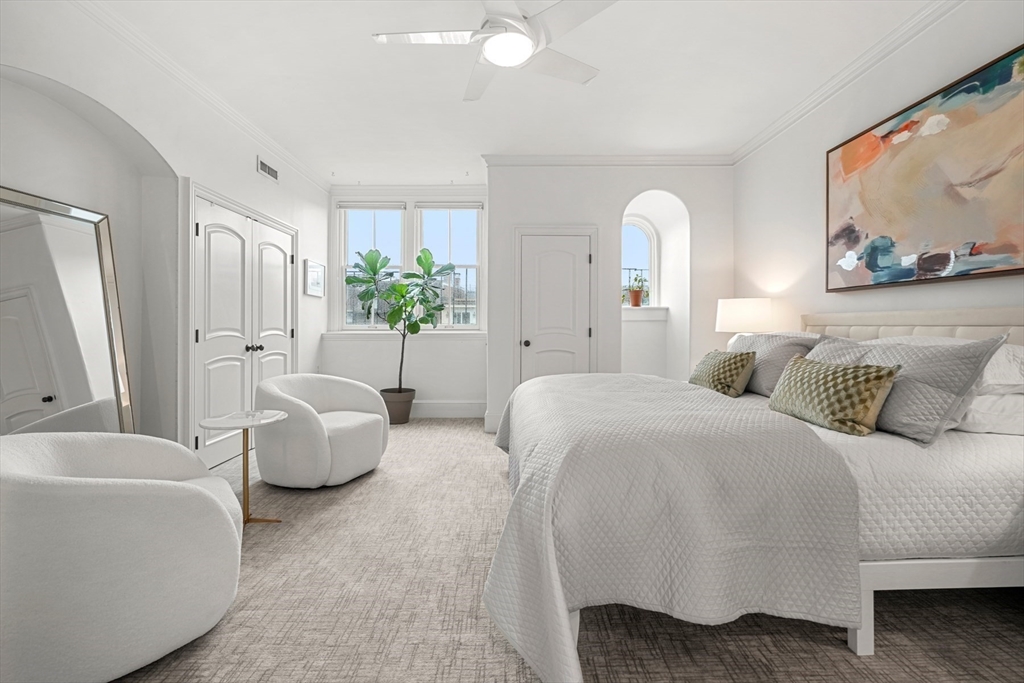 22 Rutland Square, Unit 2 Boston, MA 02118 - Photo 32 of 42 a spacious bedroom with a bed and a couch