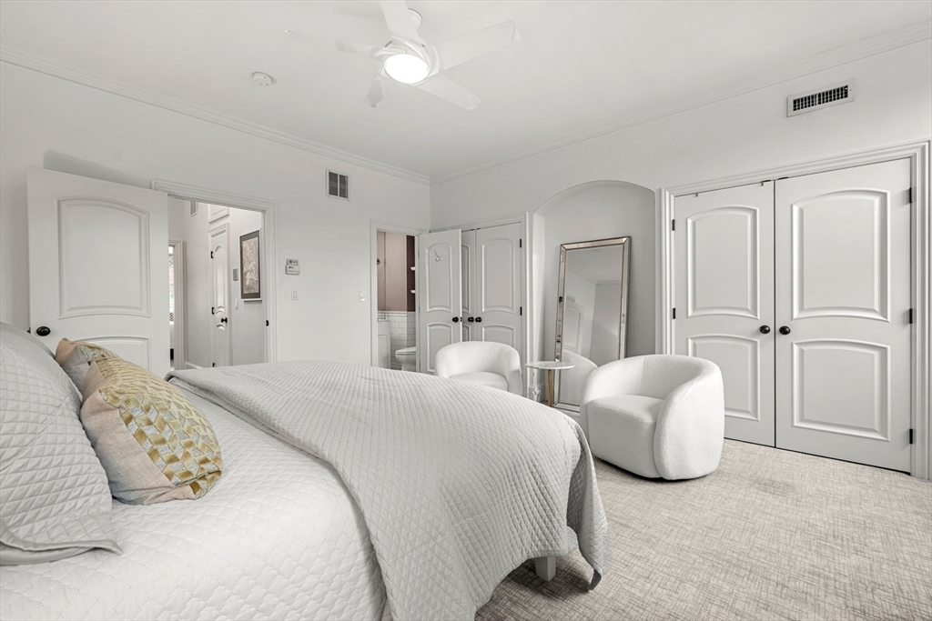 22 Rutland Square, Unit 2 Boston, MA 02118 - Photo 34 of 42 a spacious bedroom with a bed and a couch