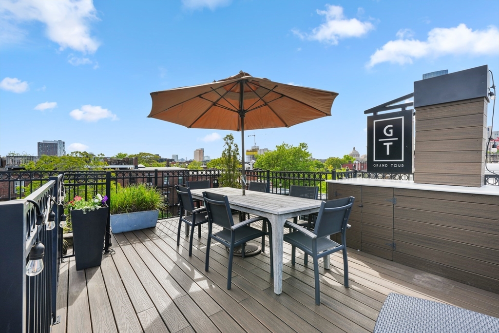 22 Rutland Square, Unit 2 Boston, MA 02118 - Photo 40 of 42 a view of a deck with furniture and a yard