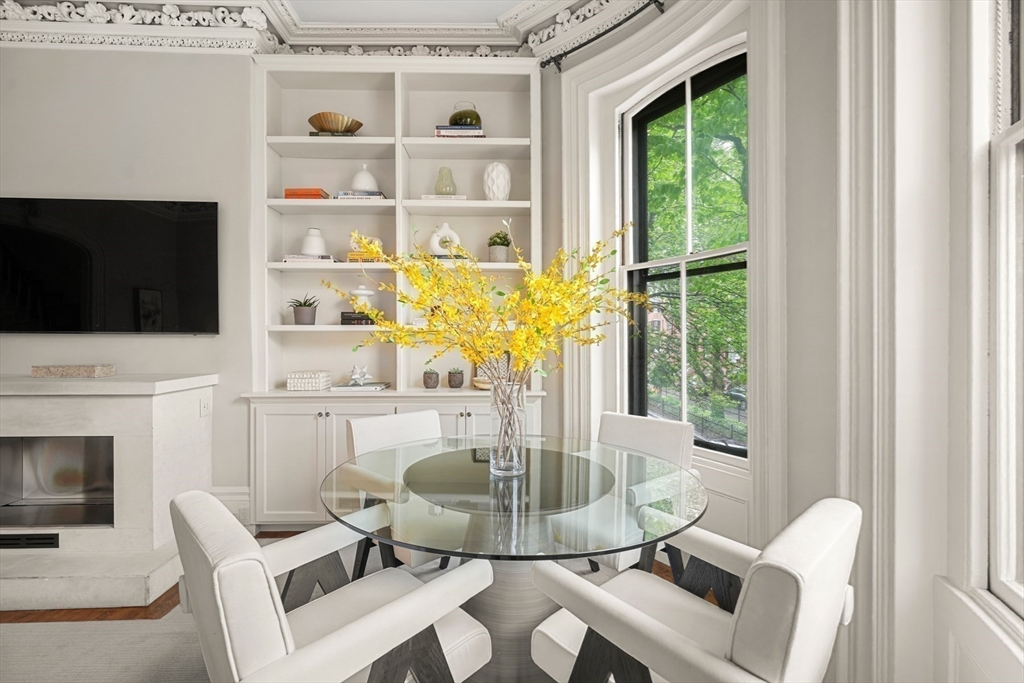 22 Rutland Square, Unit 2 Boston, MA 02118 - Photo 4 of 42 a view of a dining room with furniture window and outside view