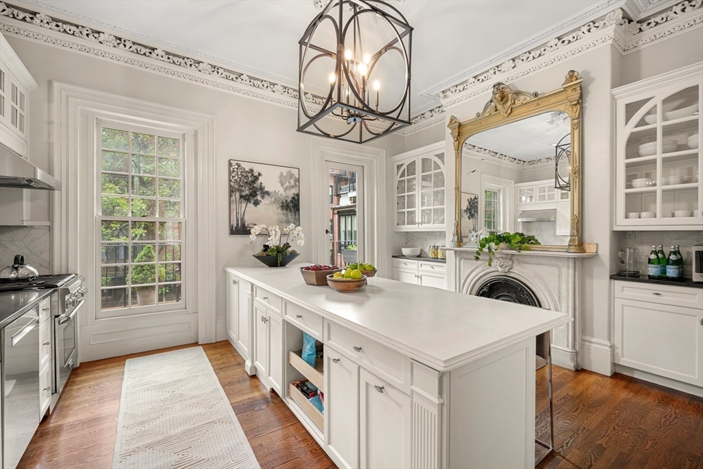 22 Rutland Square, Unit 2 Boston, MA 02118 - Photo 7 of 42 a kitchen with a stove a sink and a refrigerator