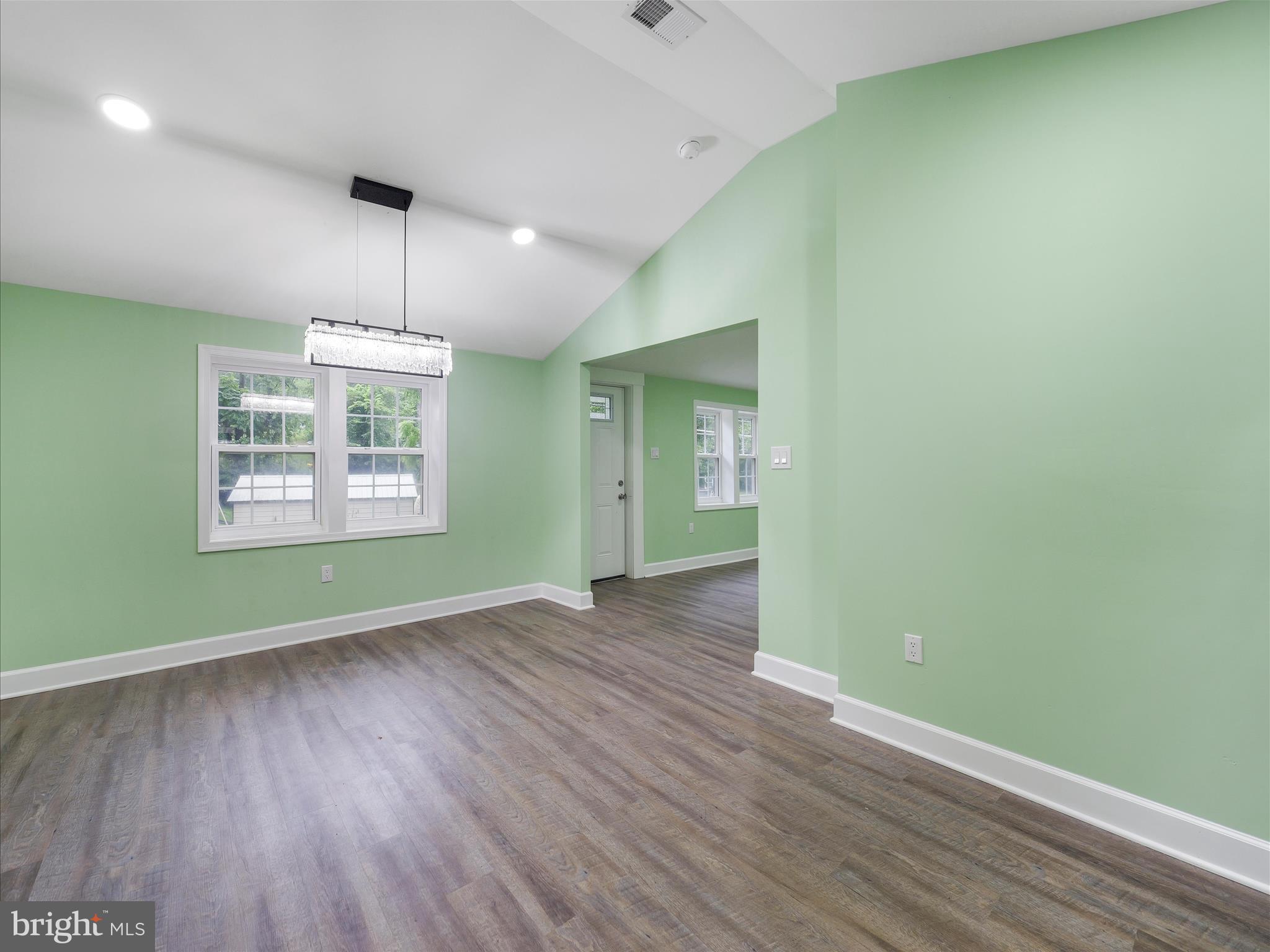 1712 Shenandoah River Drive Harpers Ferry, WV 25425 - Photo 11 of 25 an empty room with wooden floor a ceiling fan and windows