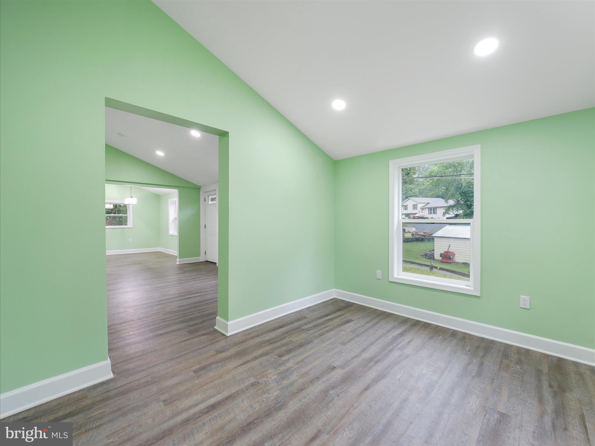 1712 Shenandoah River Drive Harpers Ferry, WV 25425 - Photo 14 of 25 an empty room with wooden floor and windows