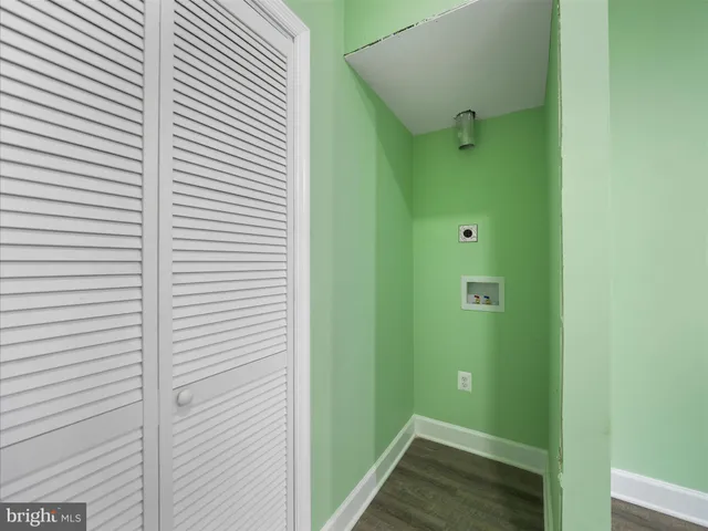 a bathroom with a shower and a sink