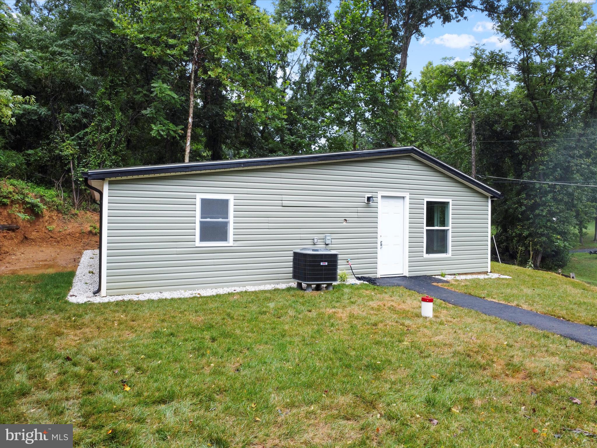 1712 Shenandoah River Drive Harpers Ferry, WV 25425 - Photo 4 of 25 a view of a house with a yard