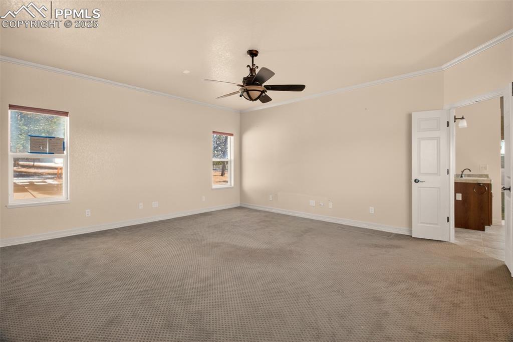 13950 Herring Road Colorado Springs, CO 80908 - Photo 19 of 50 a view of a livingroom with a chandelier fan
