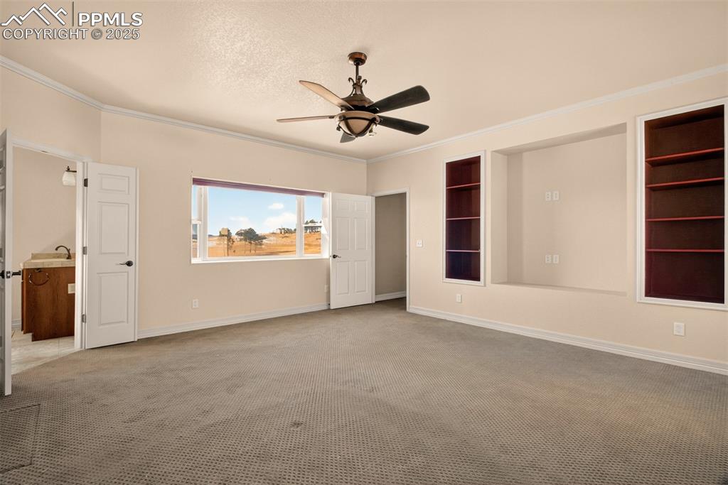 13950 Herring Road Colorado Springs, CO 80908 - Photo 20 of 50 an empty room with windows and fan
