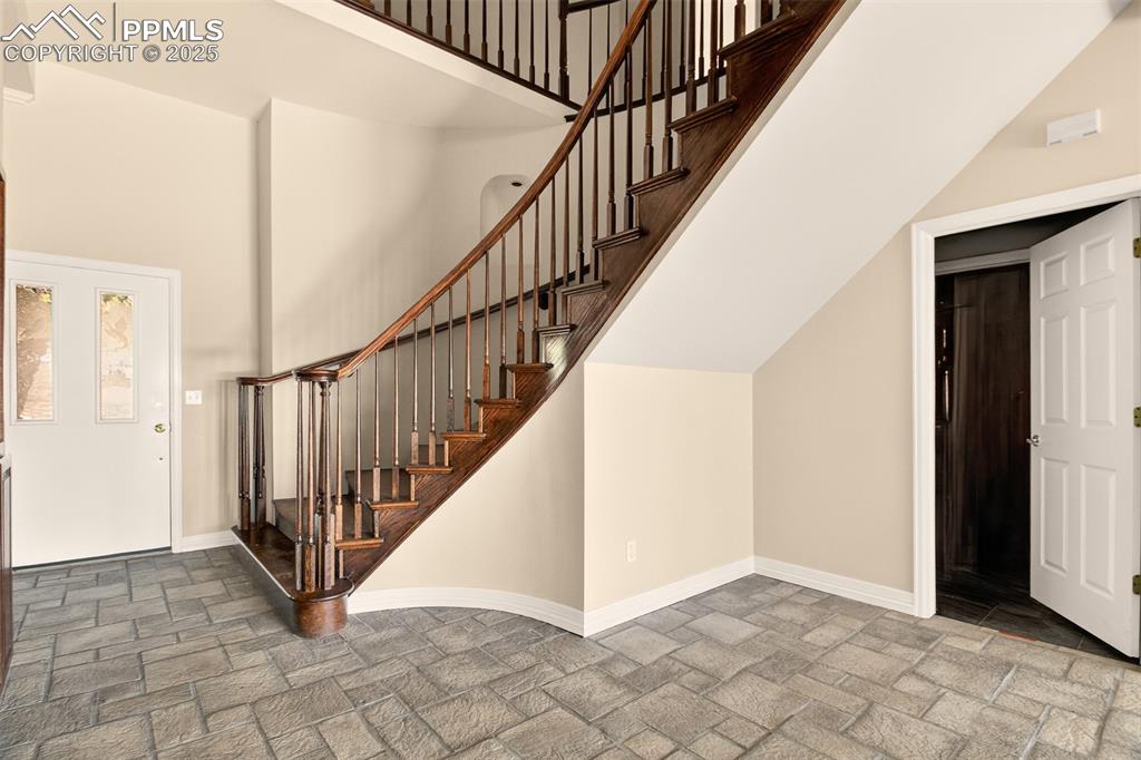 13950 Herring Road Colorado Springs, CO 80908 - Photo 25 of 50 a view of an entryway with staircase