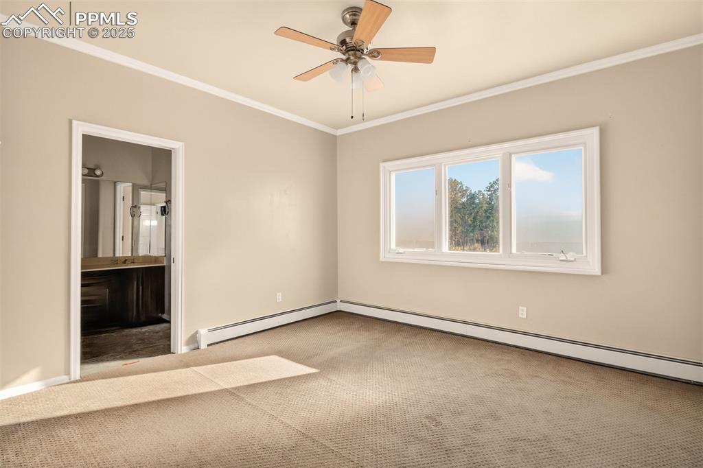 13950 Herring Road Colorado Springs, CO 80908 - Photo 31 of 50 an empty room with windows and fan