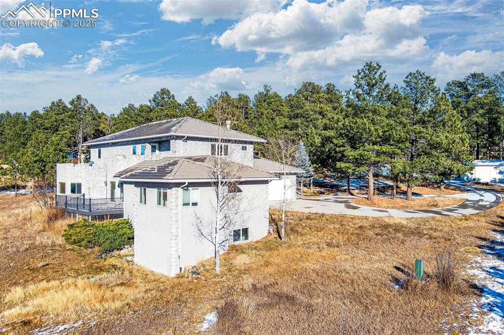 13950 Herring Road Colorado Springs, CO 80908 - Photo 47 of 50 a view of a house with a yard