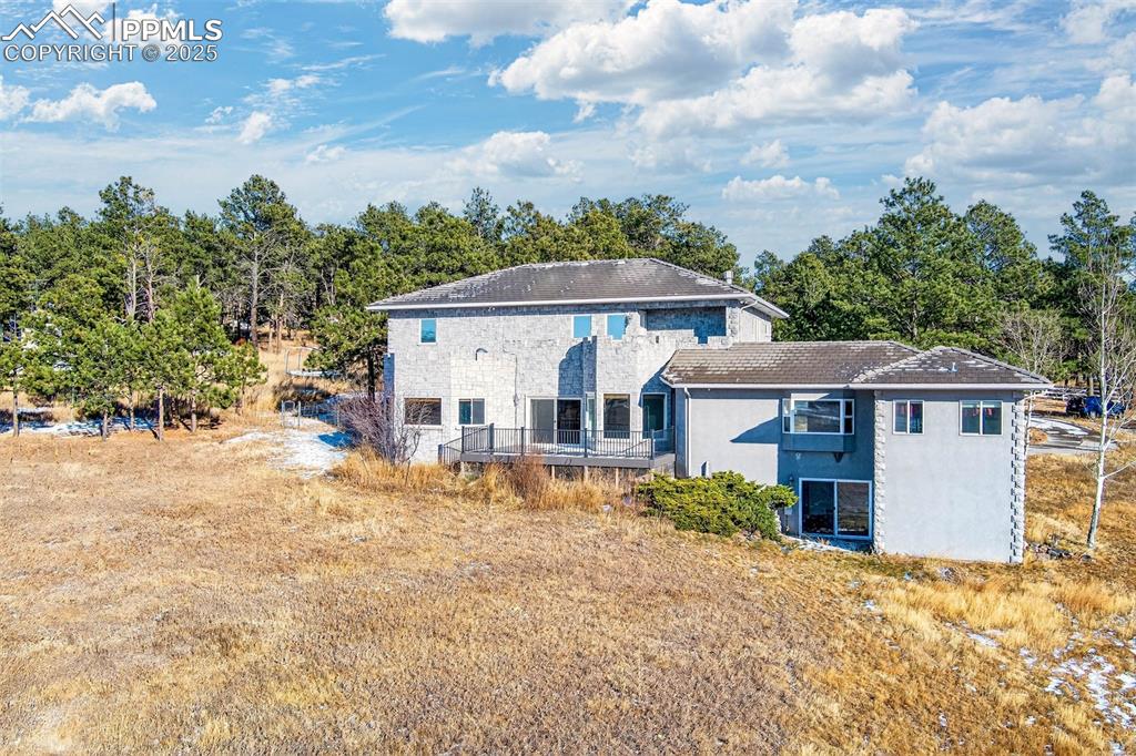 13950 Herring Road Colorado Springs, CO 80908 - Photo 48 of 50 front view of a house with a yard