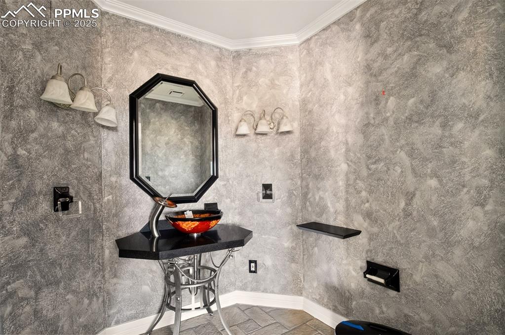 13950 Herring Road Colorado Springs, CO 80908 - Photo 9 of 50 a bathroom with a sink mirror and vanity