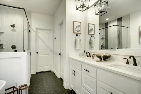 a bathroom with 2 sink and a mirror