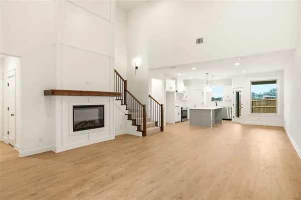 a view of a livingroom with an empty space and a fireplace