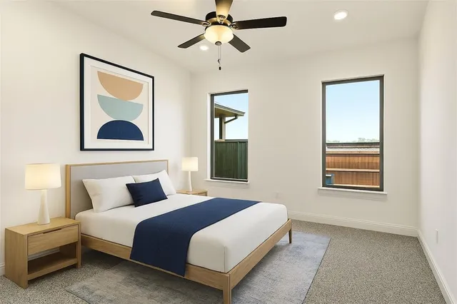 a bedroom with a bed and a painting on the wall