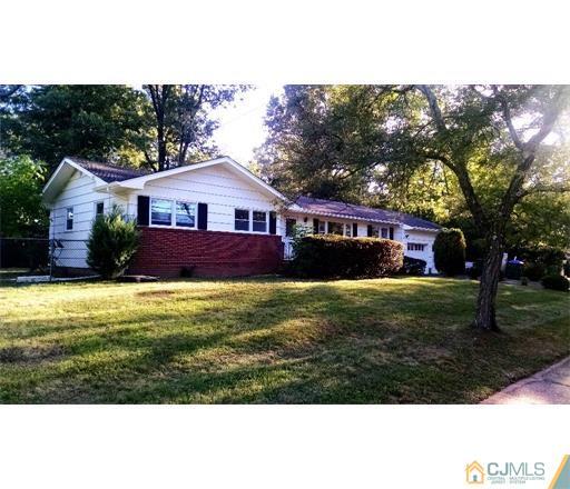 14 Pendleton Place Edison, NJ 08820 - Photo 1 of 2 a front view of house with yard and green space