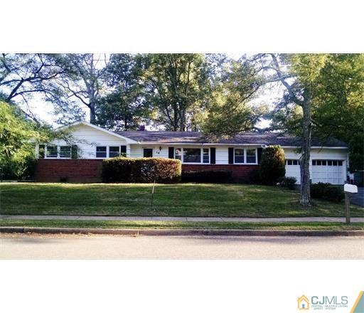 14 Pendleton Place Edison, NJ 08820 - Photo 2 of 2 a front view of a house with a yard