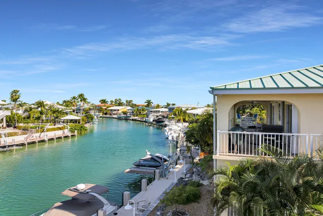 a front view of a house with a lake view