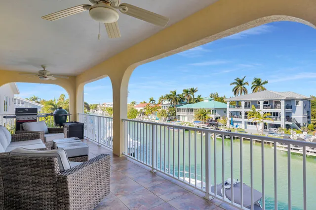 a balcony with furniture and garden view