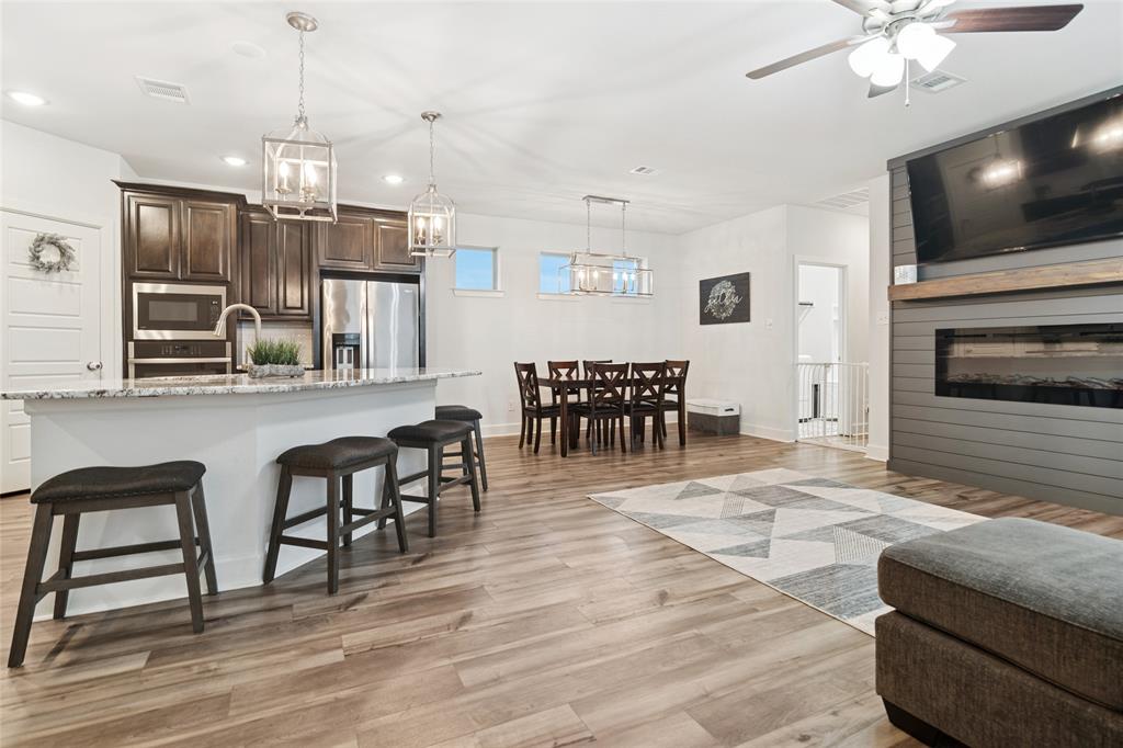 a view of a dining room with furniture wooden floor and chandelier