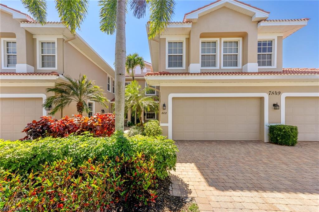 7849 Hawthorne Drive, Unit 802 Naples, FL 34113 - Photo 3 of 49 Mediterranean / Spanish-style home with a double garage