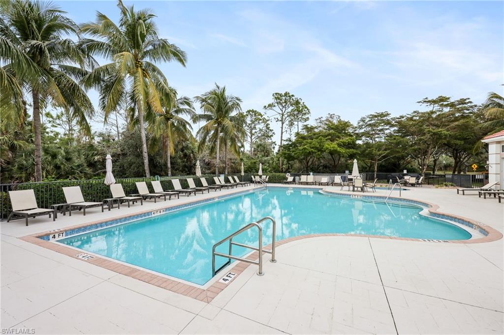 7849 Hawthorne Drive, Unit 802 Naples, FL 34113 - Photo 42 of 49 View of swimming pool with a patio area