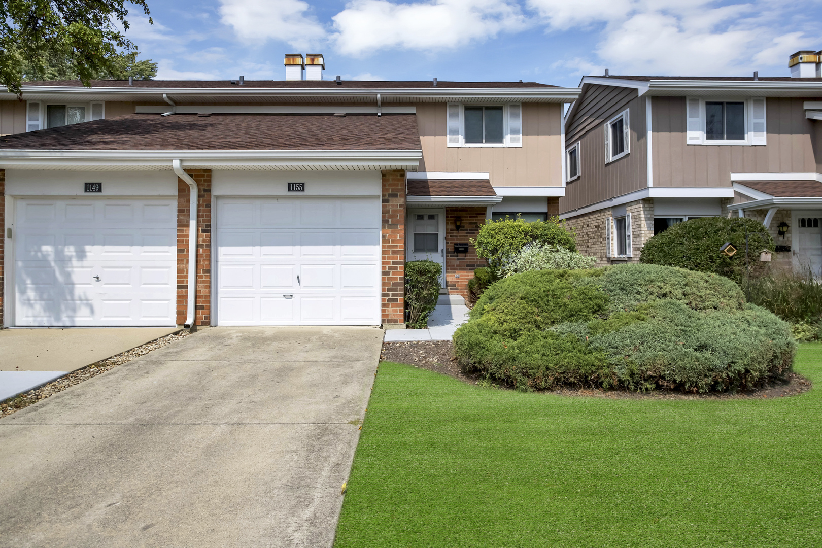 front view of a house with a yard
