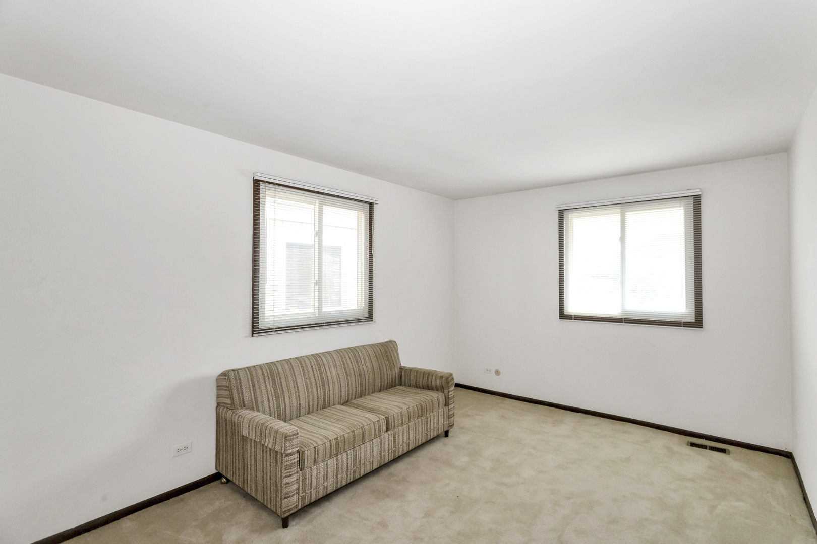 1155 Leicester Court Wheaton, IL 60189 - Photo 22 of 30 a living room with furniture and a window
