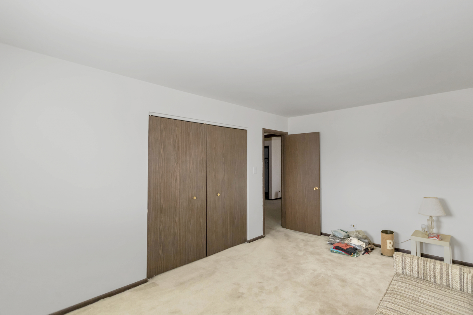 1155 Leicester Court Wheaton, IL 60189 - Photo 23 of 30 a bedroom with a bed and a closet