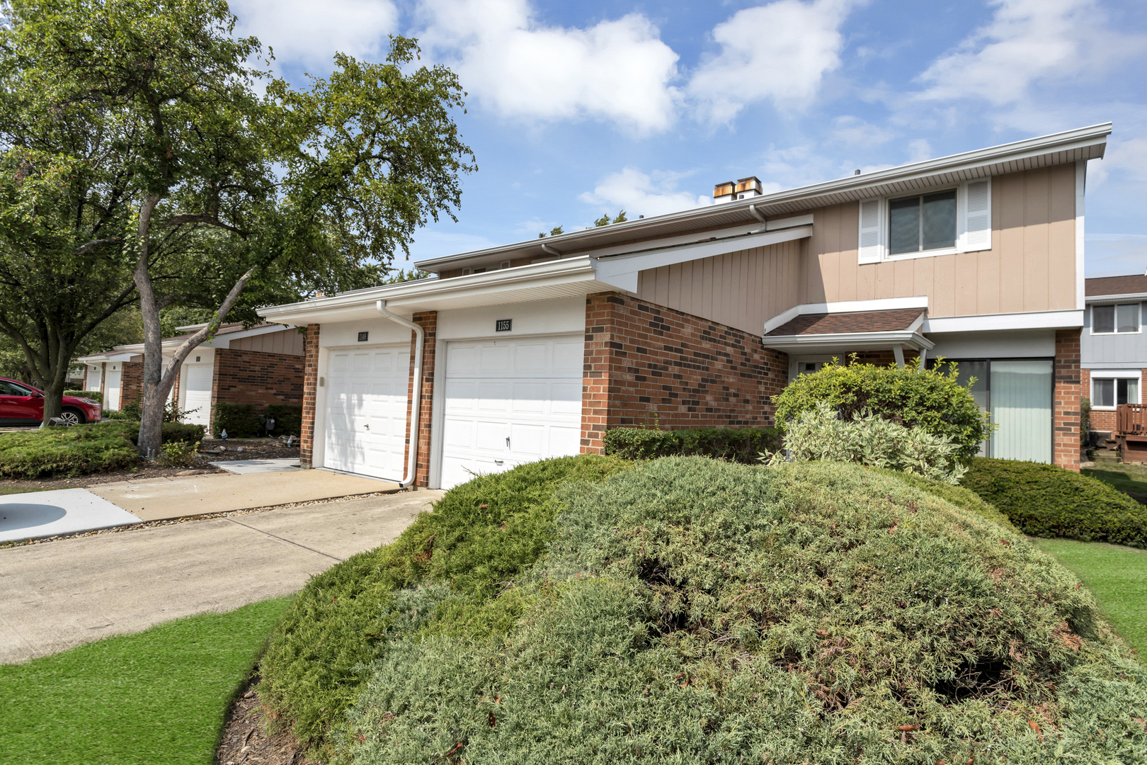 1155 Leicester Court Wheaton, IL 60189 - Photo 3 of 30 a front view of a house with a yard