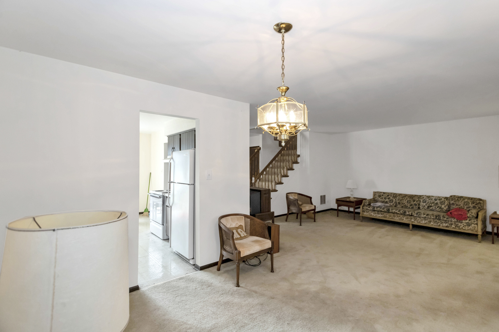 1155 Leicester Court Wheaton, IL 60189 - Photo 10 of 30 a view of a room with furniture and a chandelier