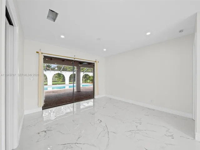 a bathroom view with a toilet and a shower