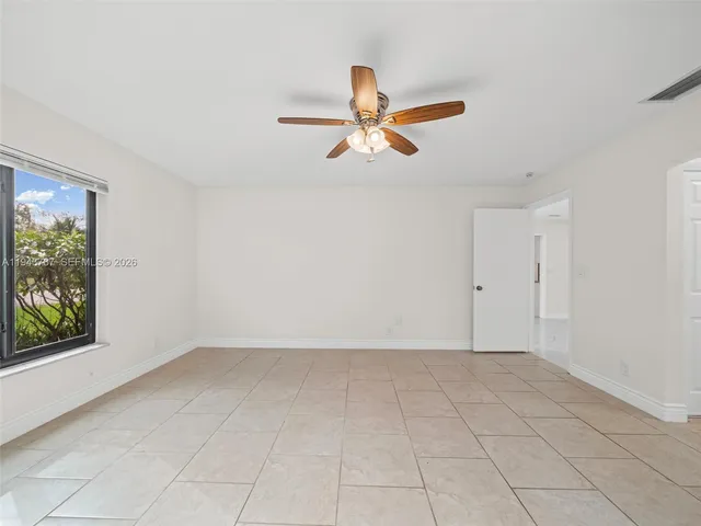 a view of a kitchen with a sink and cabinets
