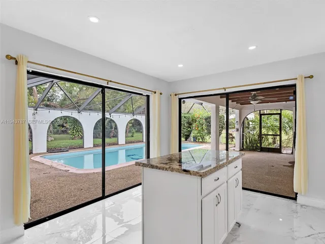 a view of a swimming pool with a yard