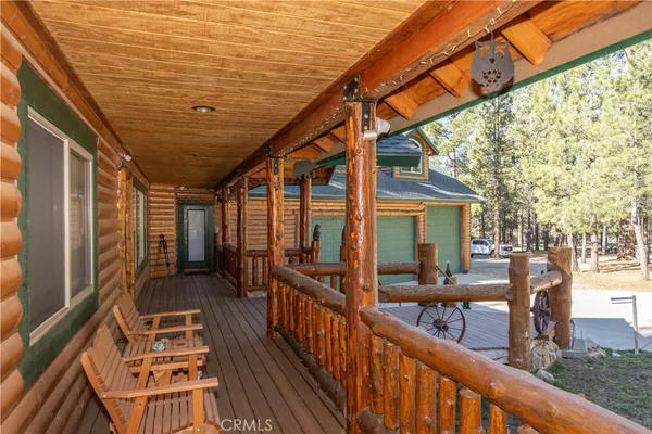 a view of a balcony with wooden floor